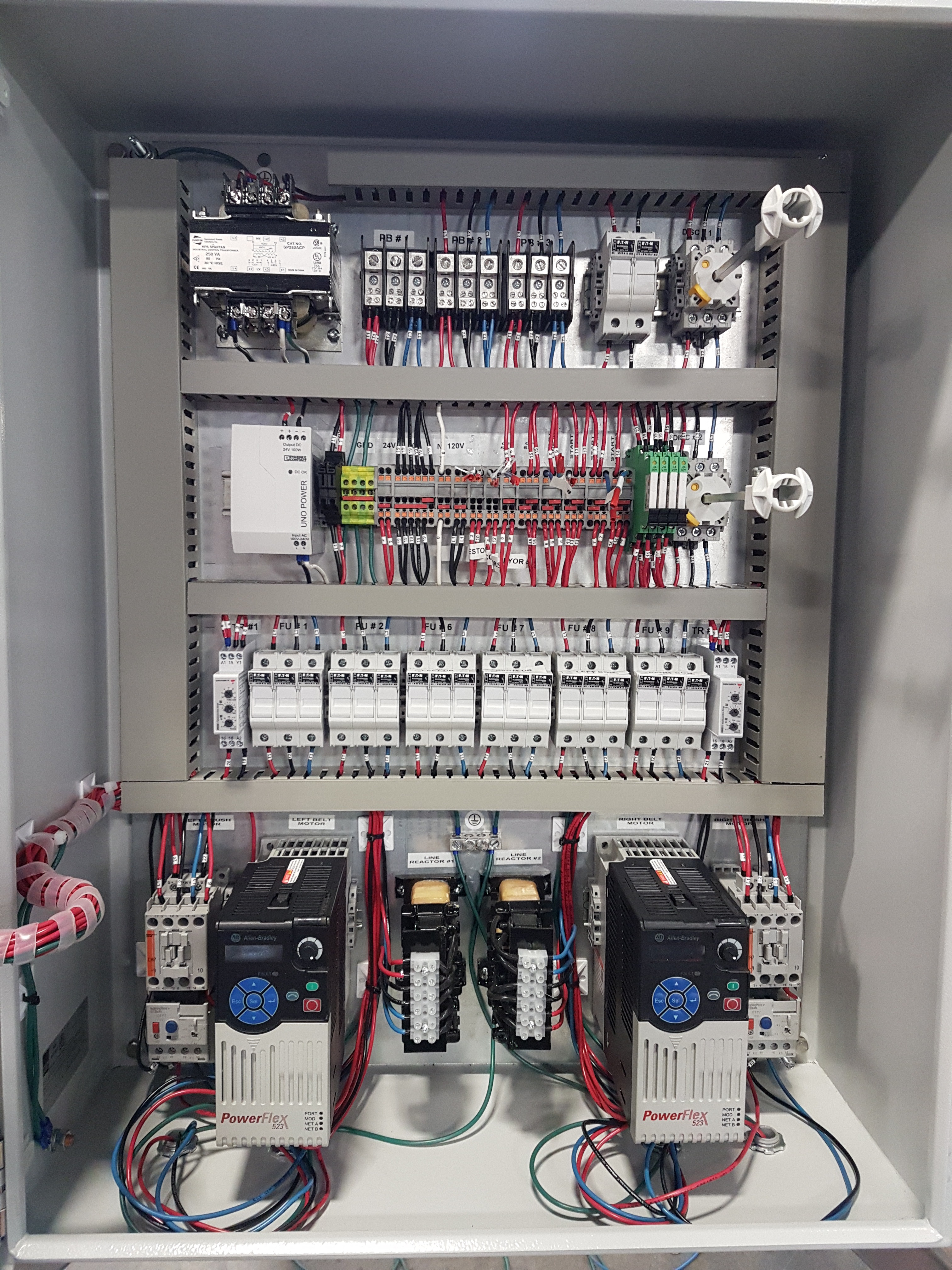 Control panel with labeled terminals and wire channels